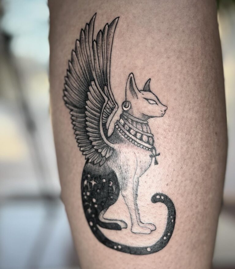Winged Bastet Egyptian cat tattoo on calf – black and grey dotwork, Hurghada