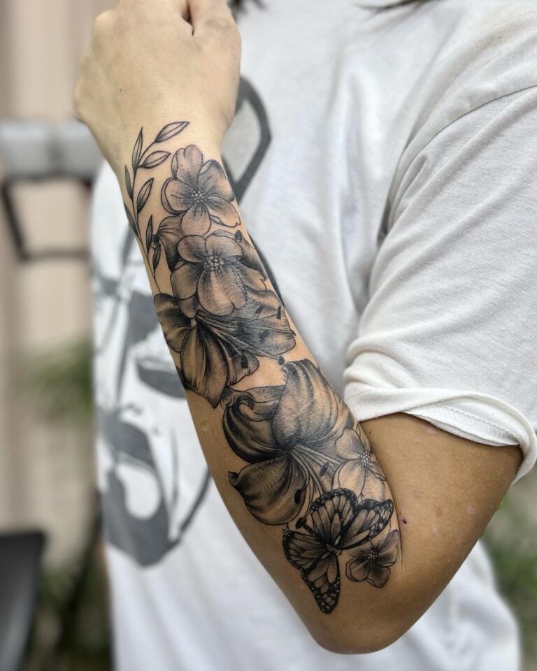 Black and grey floral forearm sleeve with lilies and hibiscus – Hurghada tattoo