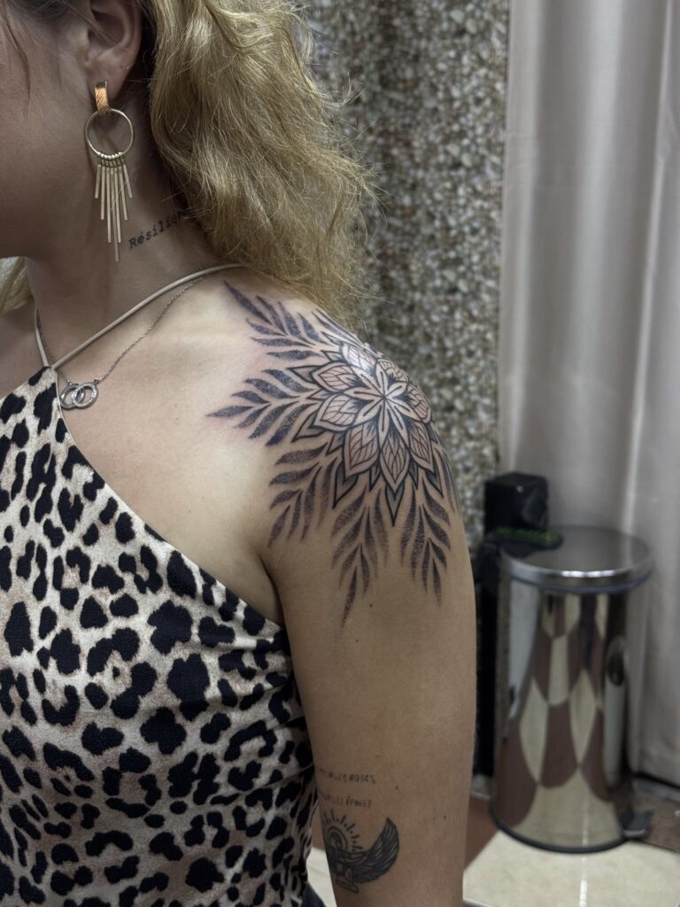 Ornamental mandala shoulder tattoo on woman – fine line, DR G Tattoo