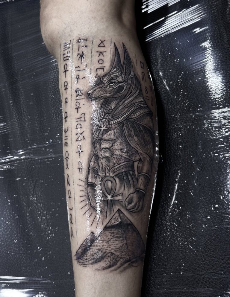 Egyptian god and hieroglyph forearm sleeve – black and grey tattoo