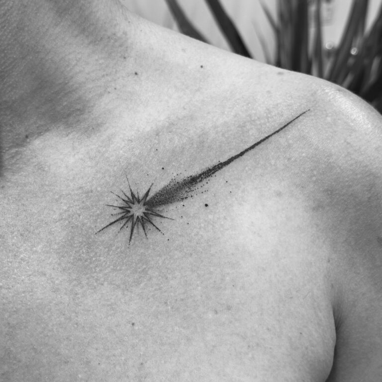 Shooting star fine line tattoo on collarbone