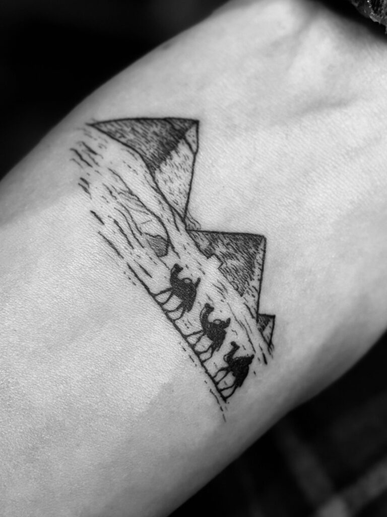 Minimal pyramids and camel caravan line tattoo – fine line Egypt souvenir tattoo